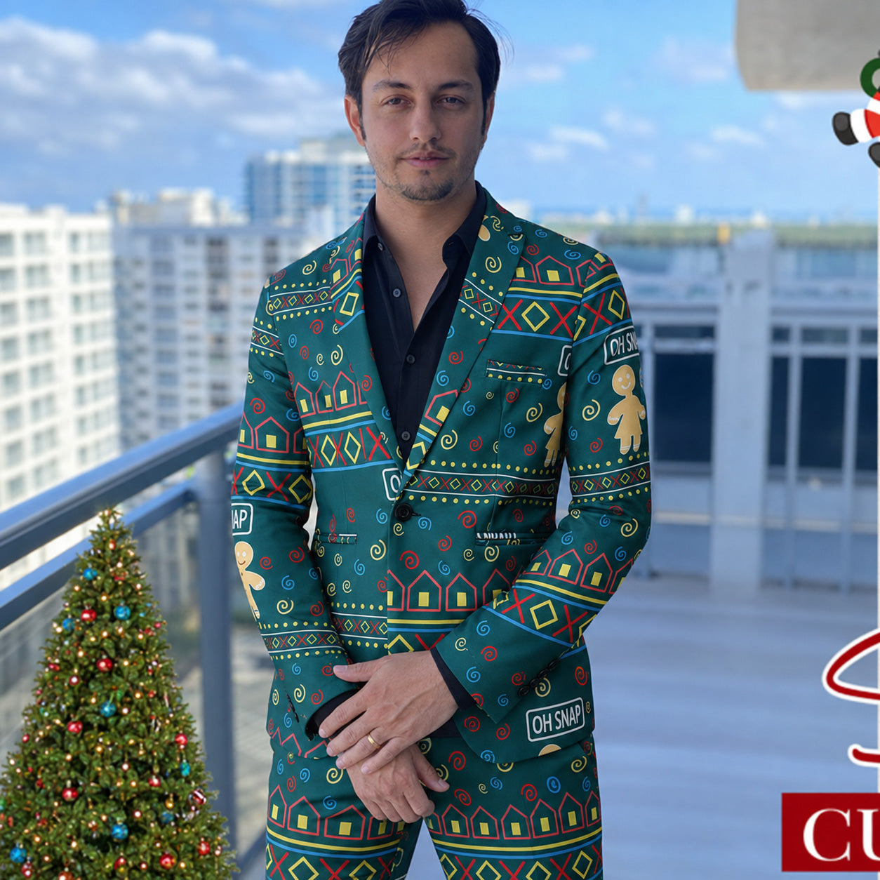 Man wearing green gingerbread ugly Christmas party suit outdoors on balcony - WISHOLIC