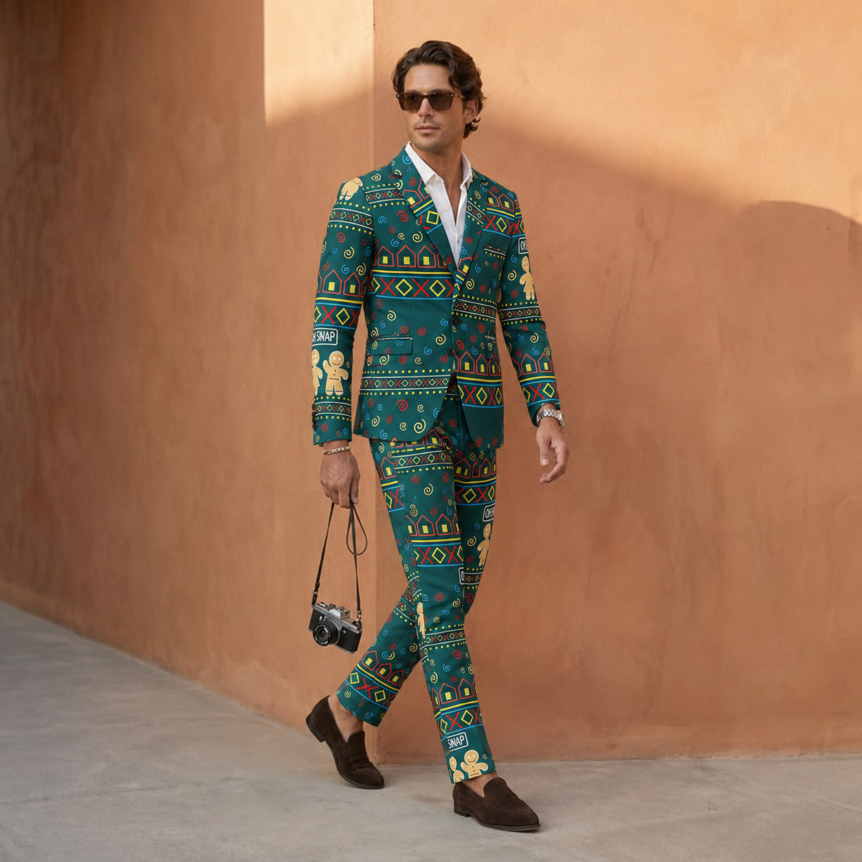 Stylish man walking in green gingerbread patterned Christmas suit set with sunglasses - WISHOLIC