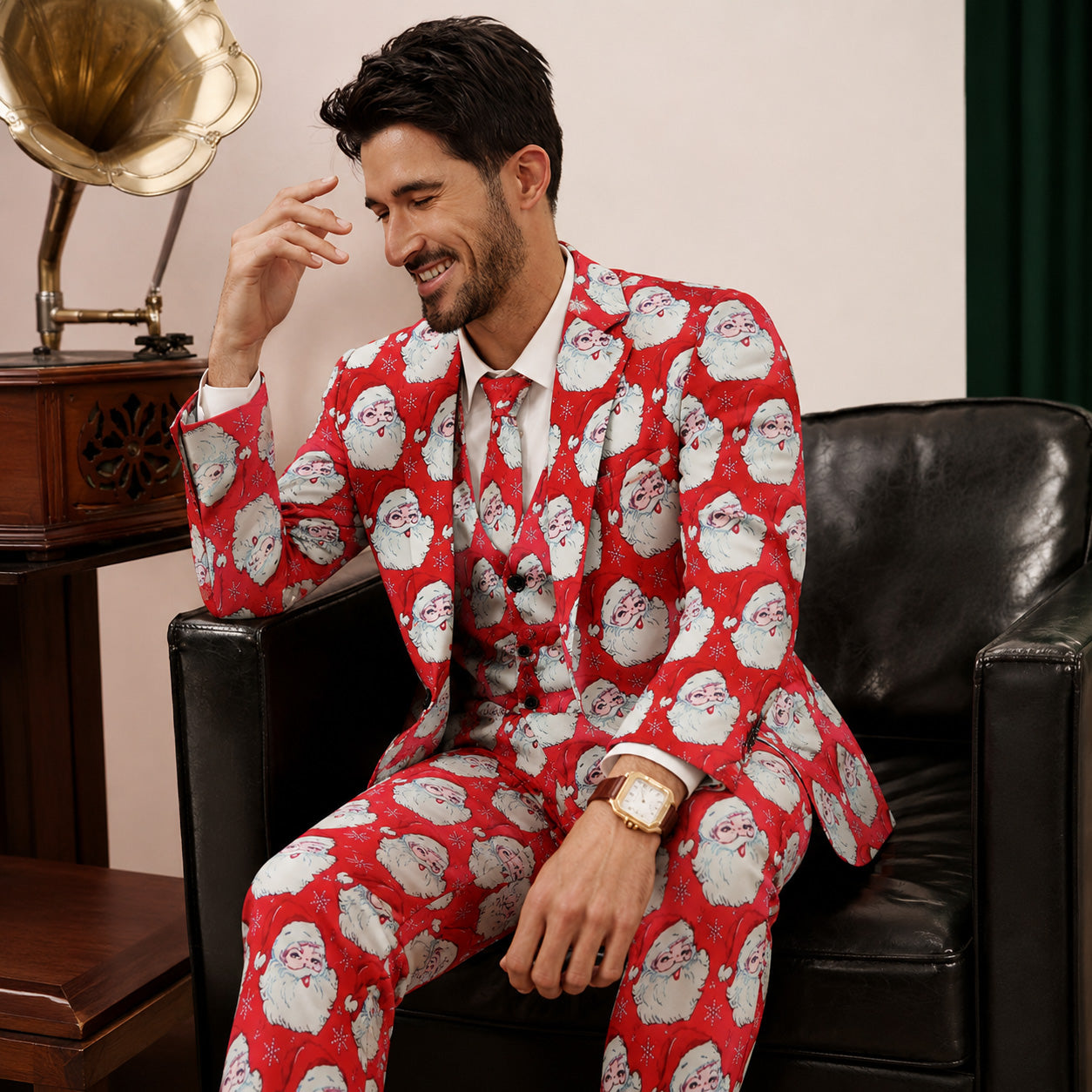 Man sitting in armchair wearing red Santa Claus pattern holiday party suit - WISHOLIC