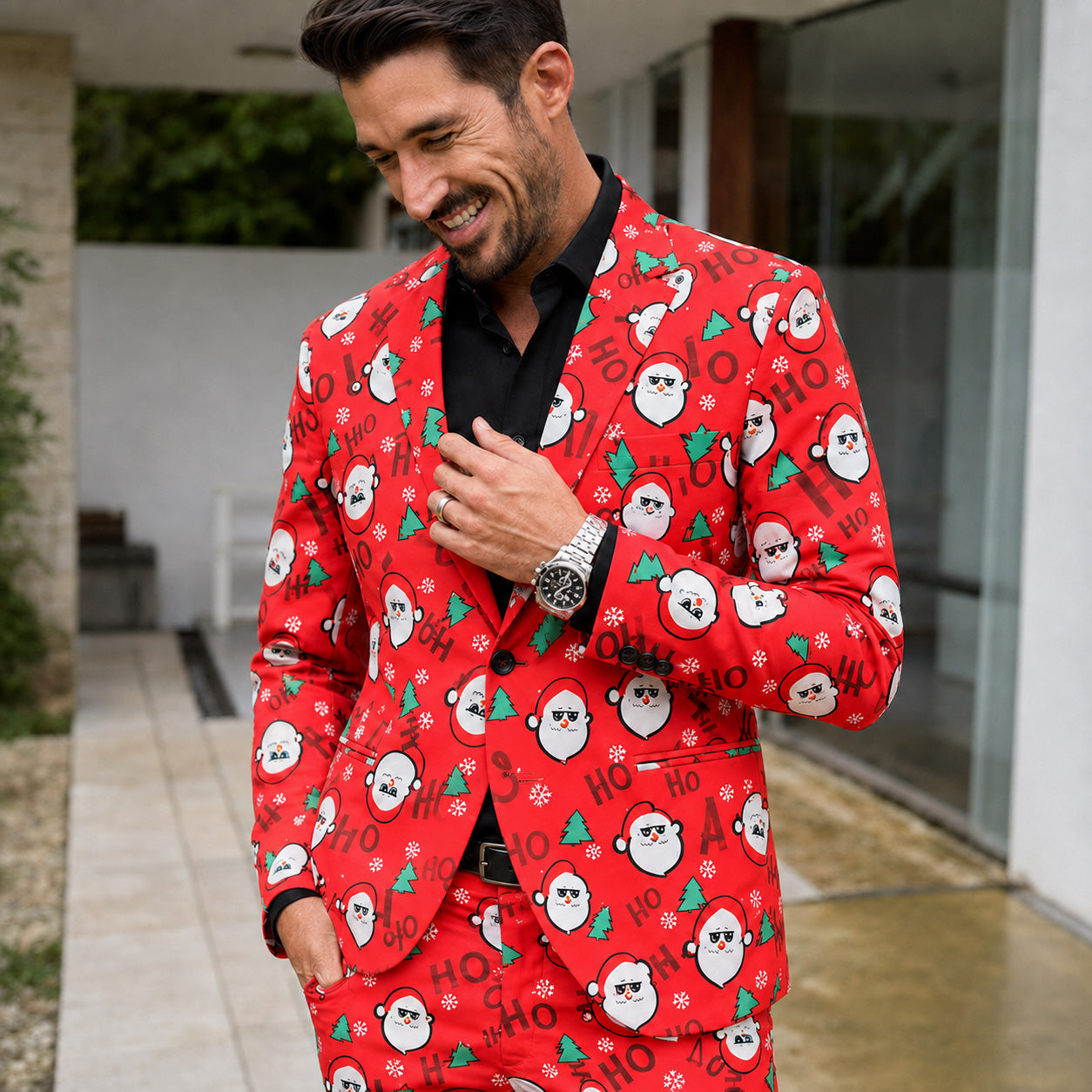 A close-up shot of a man wearing a red suit jacket with Santa Claus print by WISHOLIC.