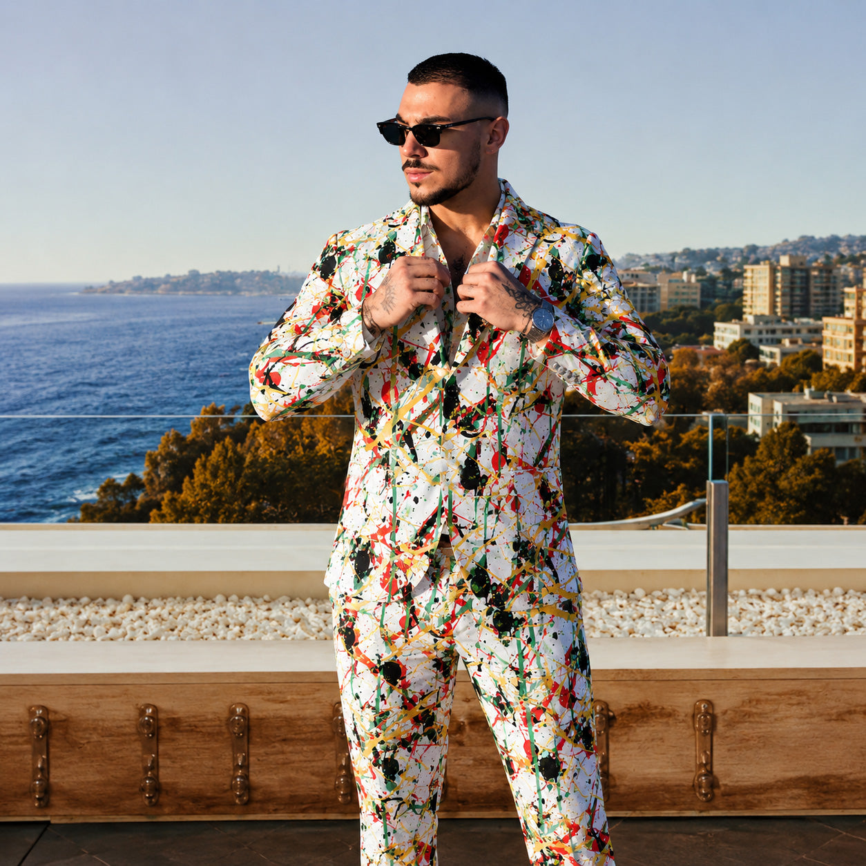 Make a memorable impression.
Our men's white art suit features a vibrant multicolored splatter paint design on a premium white backdrop.