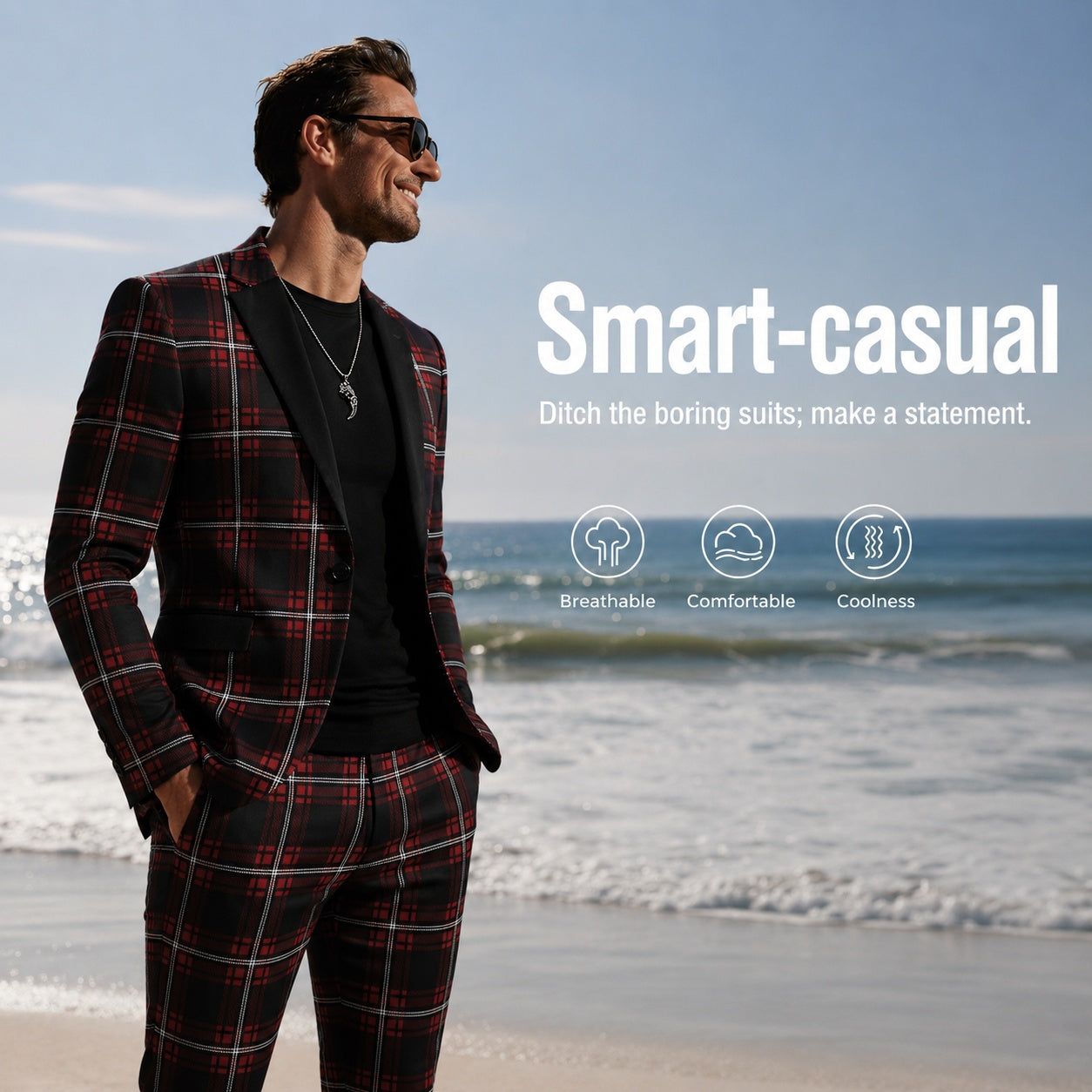 A male model wearing a red and black plaid suit walking on the beach, showcasing a comfortable and breathable summer smart-casual lifestyle.