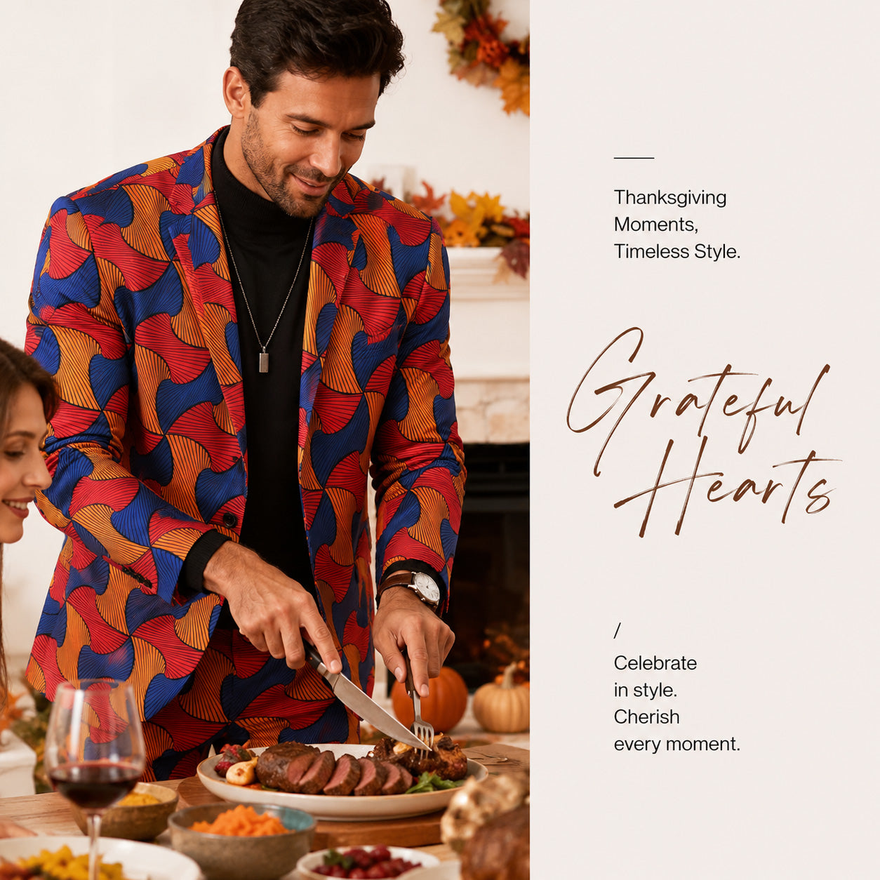 A smiling man carving turkey at a Thanksgiving dinner table, wearing a festive African print holiday suit over a black turtleneck.