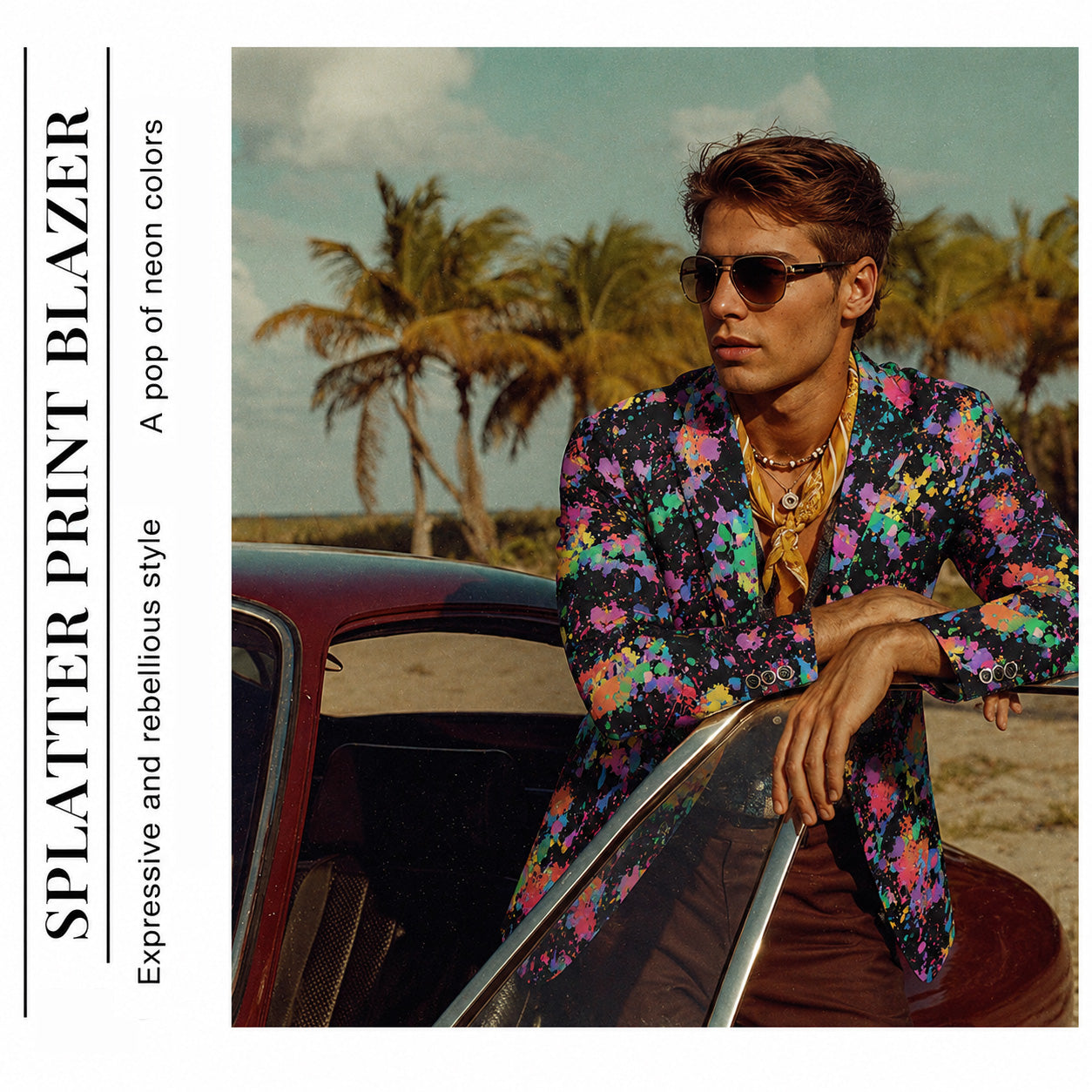 Editorial style shot of a man wearing a splatter print blazer with a yellow silk neck scarf, leaning on a classic car.