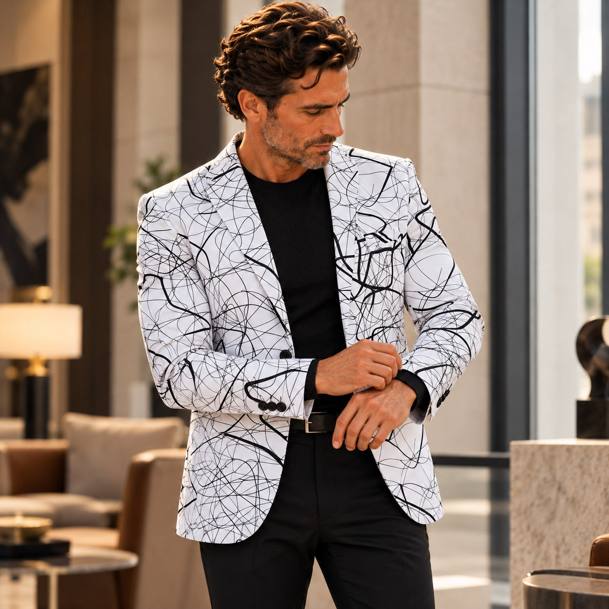Wisholic abstract line art blazer paired with black top and black trousers in an upscale indoor setting[cite: 45]