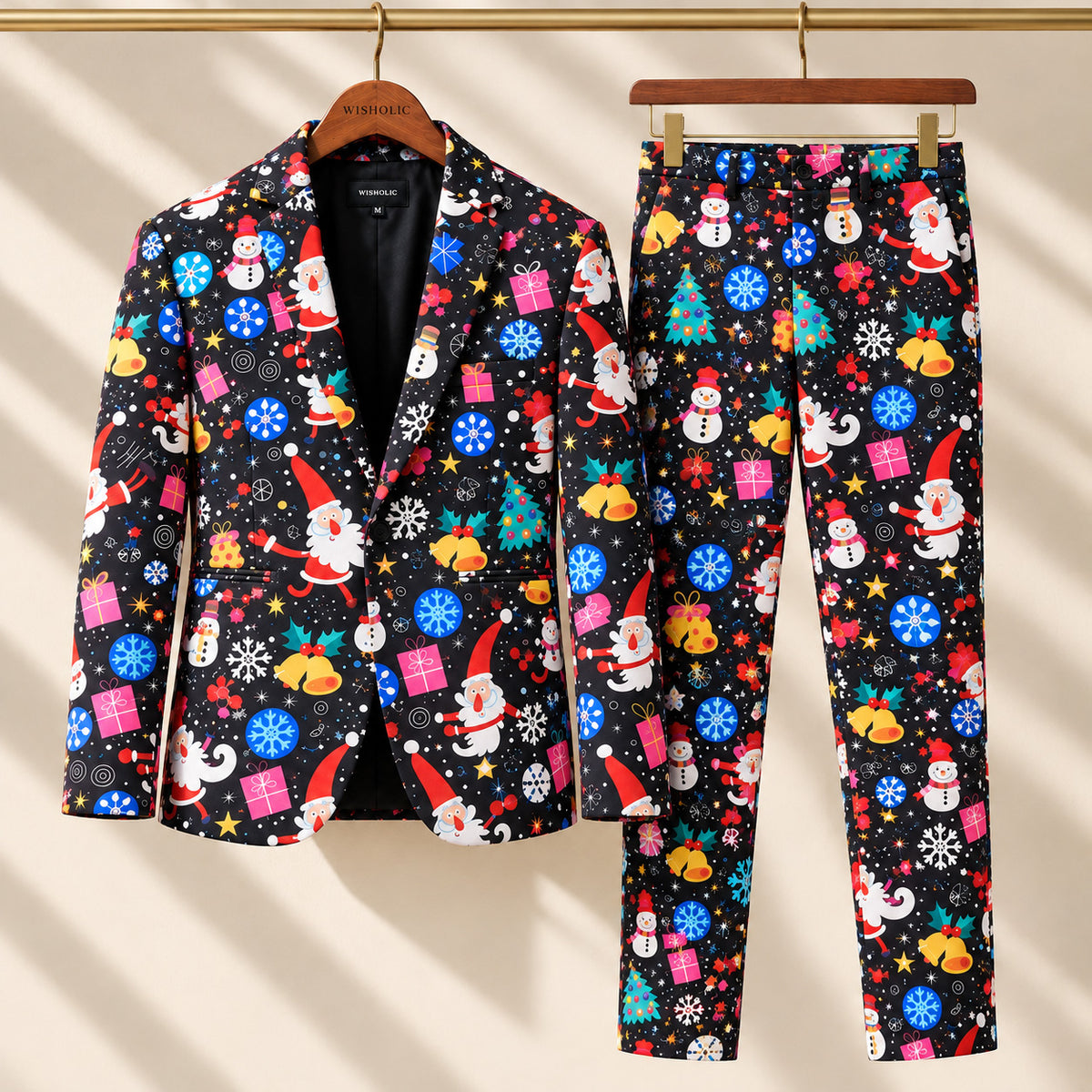 Wisholic black Christmas printed suit set with blazer and matching trousers hanging on gold rack.