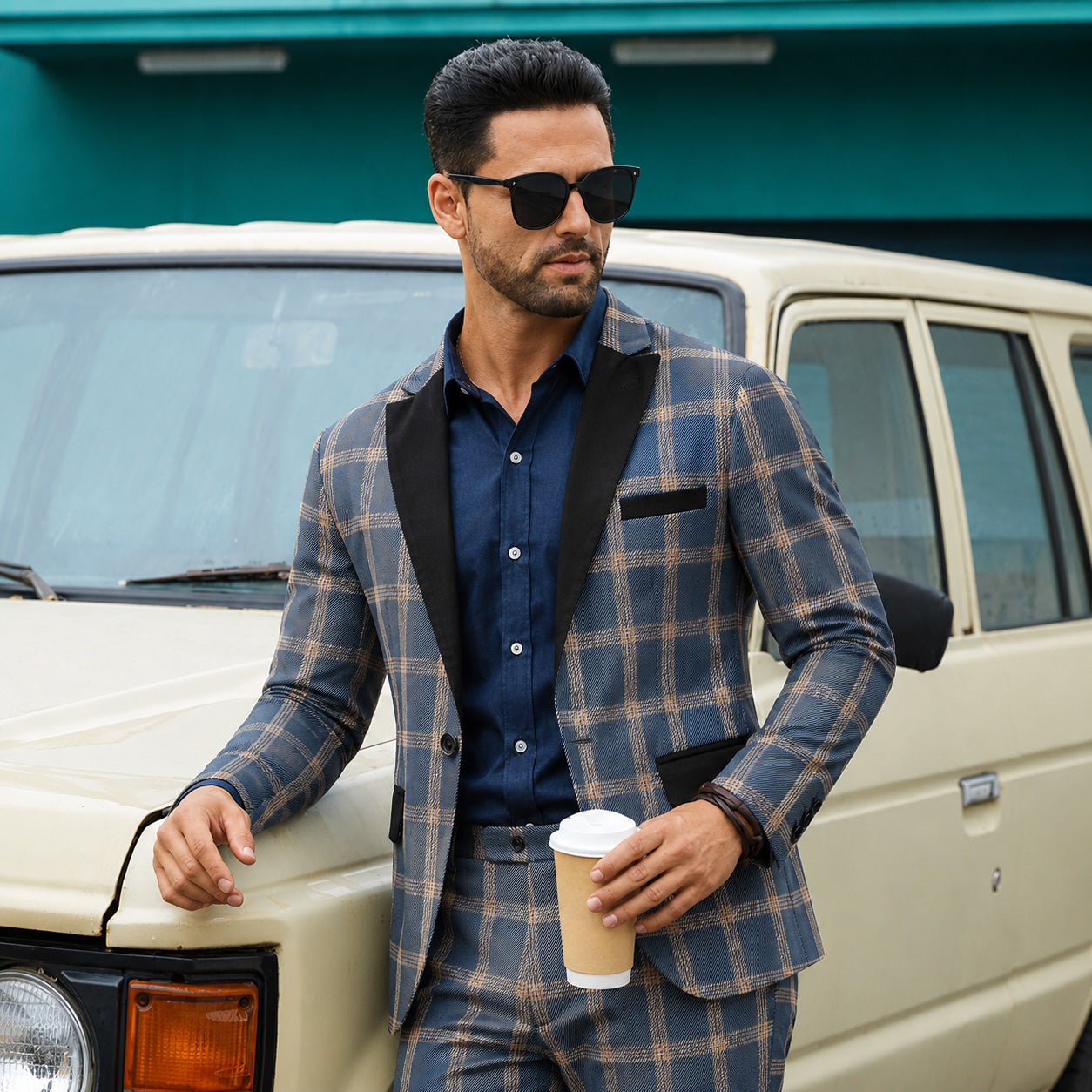 Wisholic men's luxury blue plaid blazer featuring a premium black contrast lapel, captured in an elegant vintage lifestyle setting.