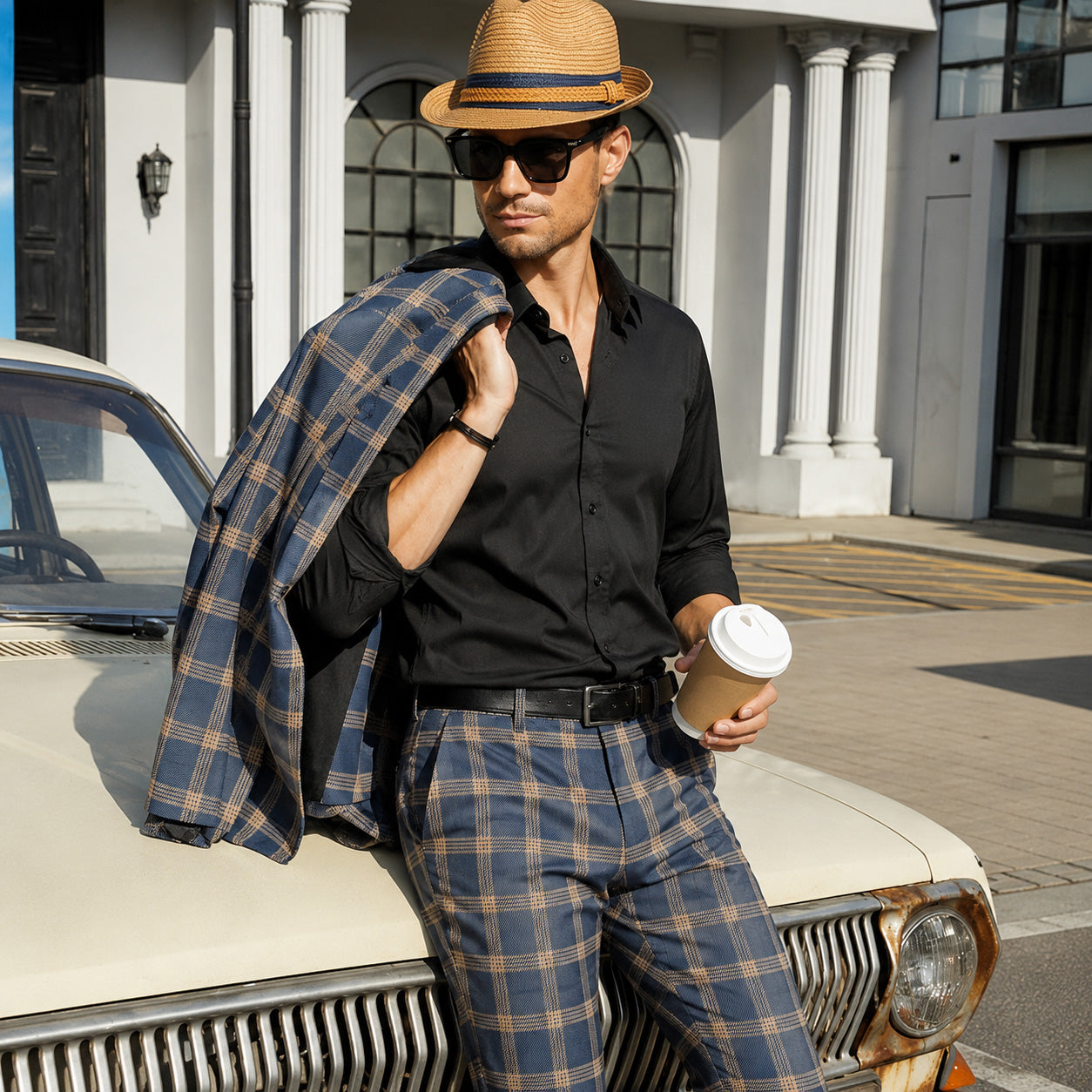 Effortless summer dapper look showcasing Wisholic blue plaid suit trousers and a black button-down shirt paired with a fedora hat.