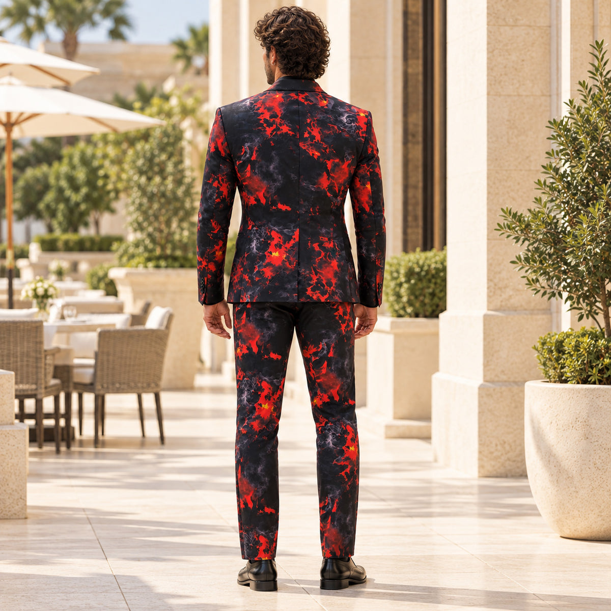 Back view of WISHOLIC men's crimson red and black flame print two-piece suit showing the matching blazer, single back vent and tailored trousers.
