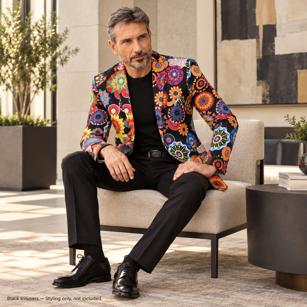 WISHOLIC Kaleidoscope Floral statement blazer styled with black trousers and black dress shoes for a sophisticated artistic look. Black trousers not included.