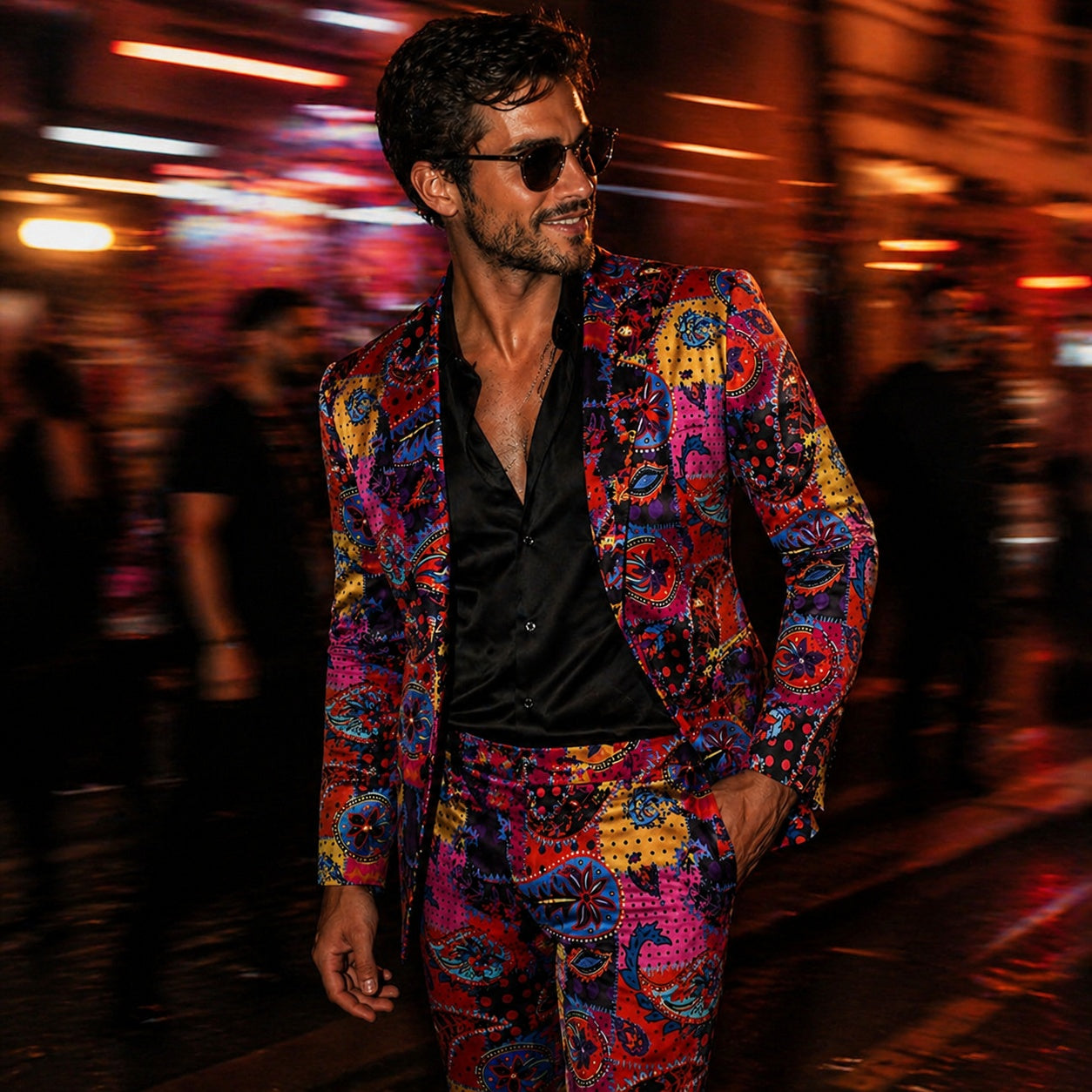 Men's slim fit suit featuring a vibrant multi-colored artistic paisley print, paired with a black silk shirt for a luxury evening look.