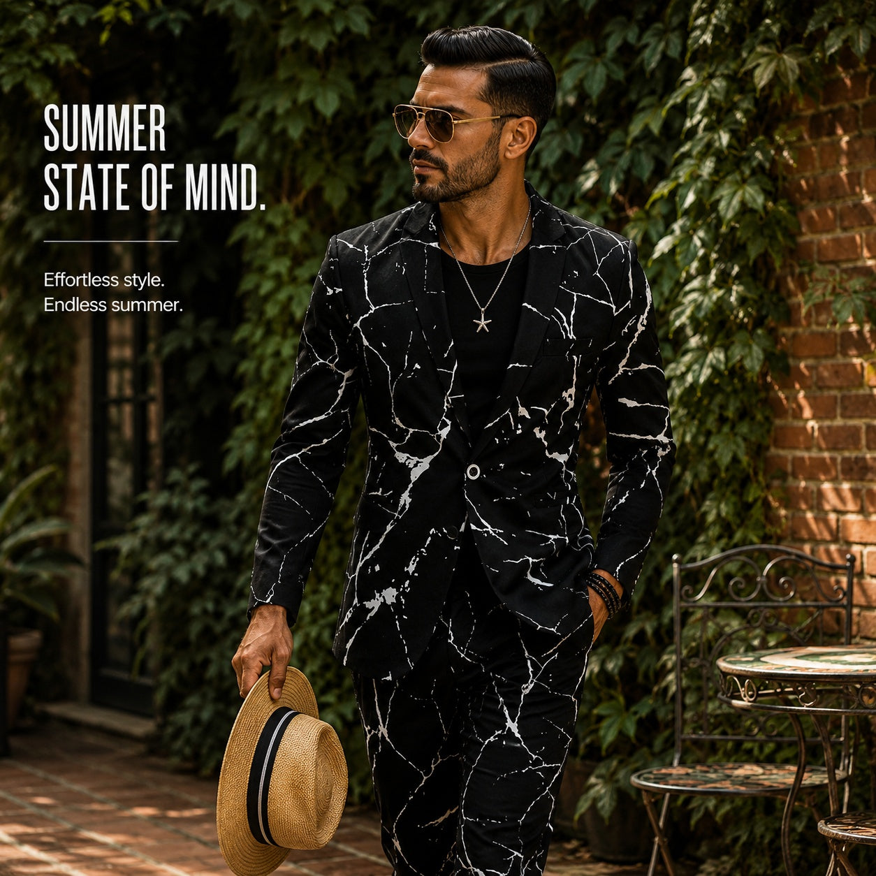 Man walking outdoors in a Wisholic marble printed blazer, holding a straw hat, perfect for a refined summer vacation aesthetic.