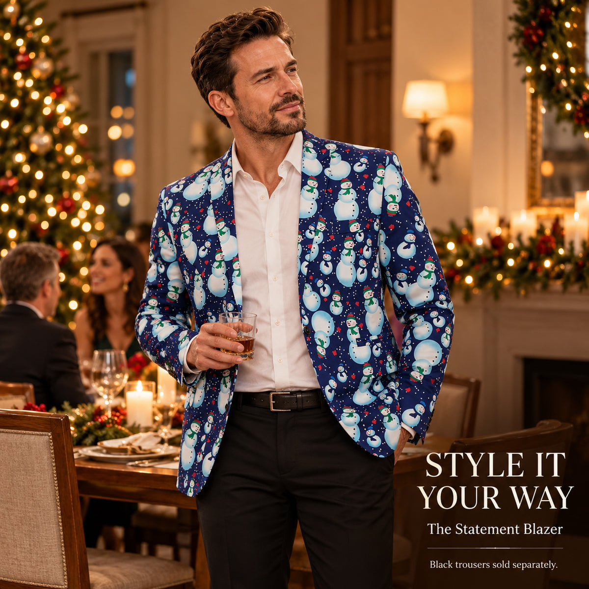 Wisholic men's blue snowman print Christmas statement blazer styled with a white shirt and black trousers at a cozy holiday dinner.