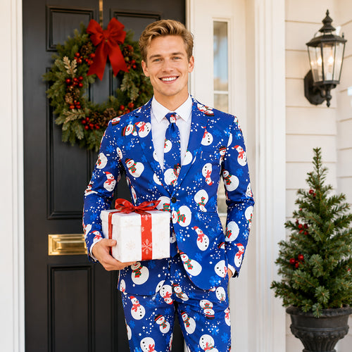 Wisholic men's royal blue Christmas suit set with snowman print and matching tie, holding a holiday gift box