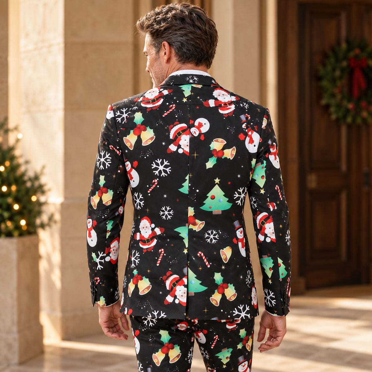 Back view of WISHOLIC men's black Christmas print suit showing festive Santa, snowman and Christmas tree patterns and tailored blazer silhouette.