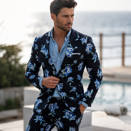 Athletic model in Wisholic dark blue floral blazer jacket paired with a light blue button-down shirt by the poolside.