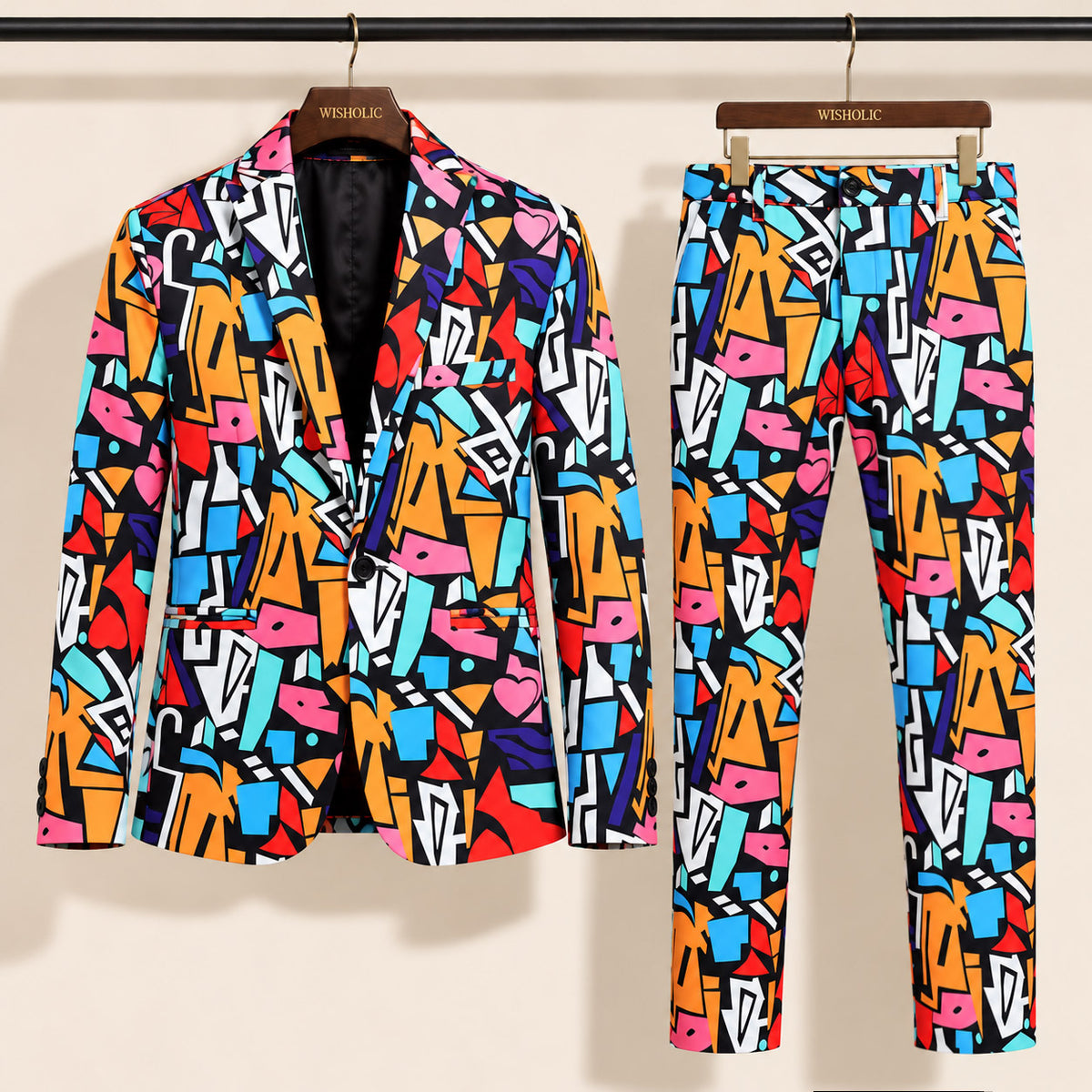 WISHOLIC men's multicolor graffiti print suit featuring a single-button blazer and matching patterned trousers displayed on wooden hangers.