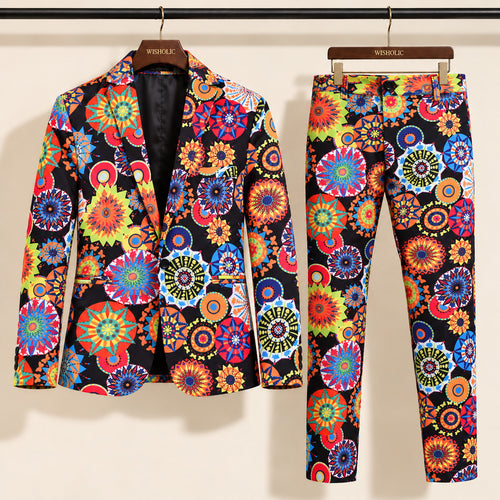 Wisholic 2-piece men's party suit set featuring black multicolor kaleidoscope floral print blazer and matching tailored trousers on hangers