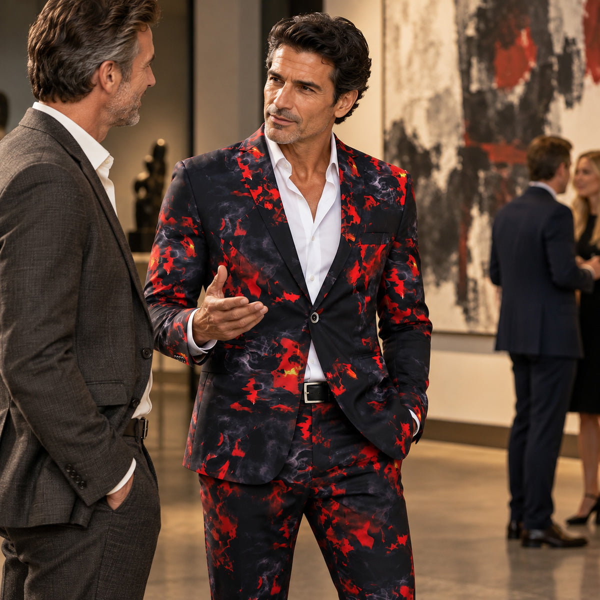 Man wearing Wisholic red abstract flame print suit conversing at a luxury party or art gallery