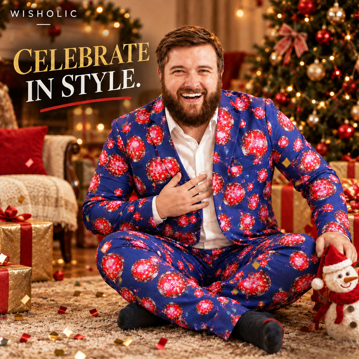 Wisholic men's plus-size Christmas suit featuring festive red ornament print, modeled by a smiling bearded man sitting on the floor with holiday gifts.