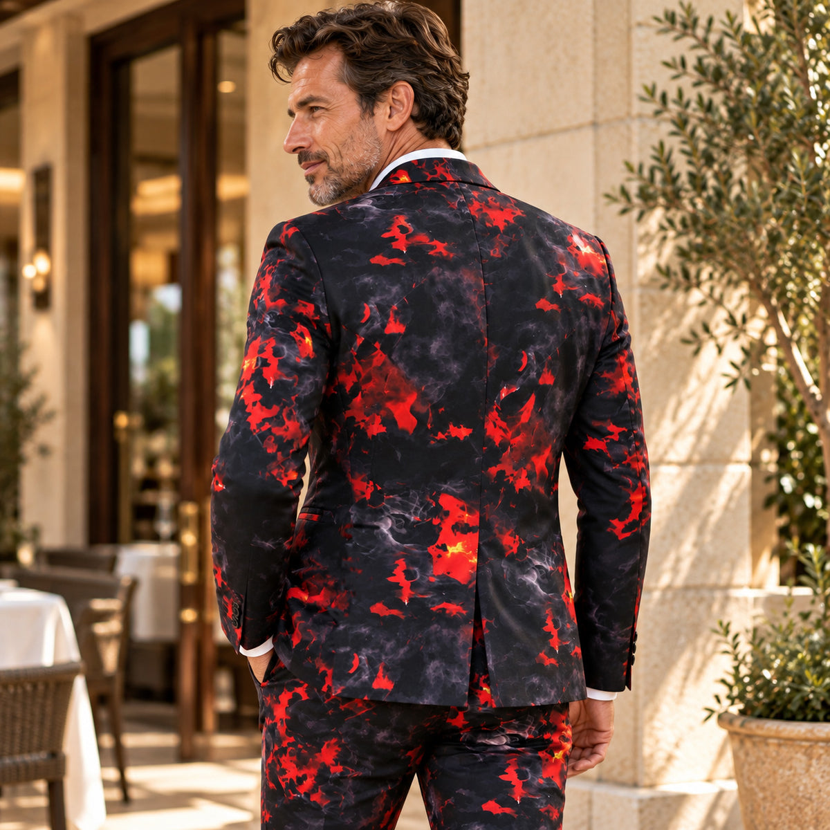 Back view of the Wisholic men's red and black flame pattern suit jacket and matching trousers outdoors.