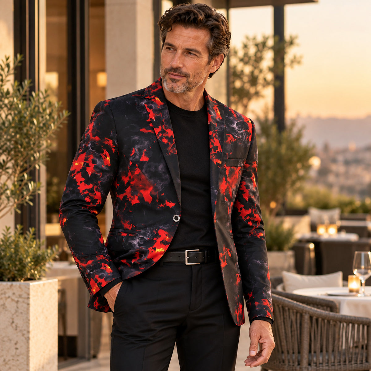 Wisholic men's red and black flame printed blazer styled casually over a black crew neck t-shirt and black trousers.