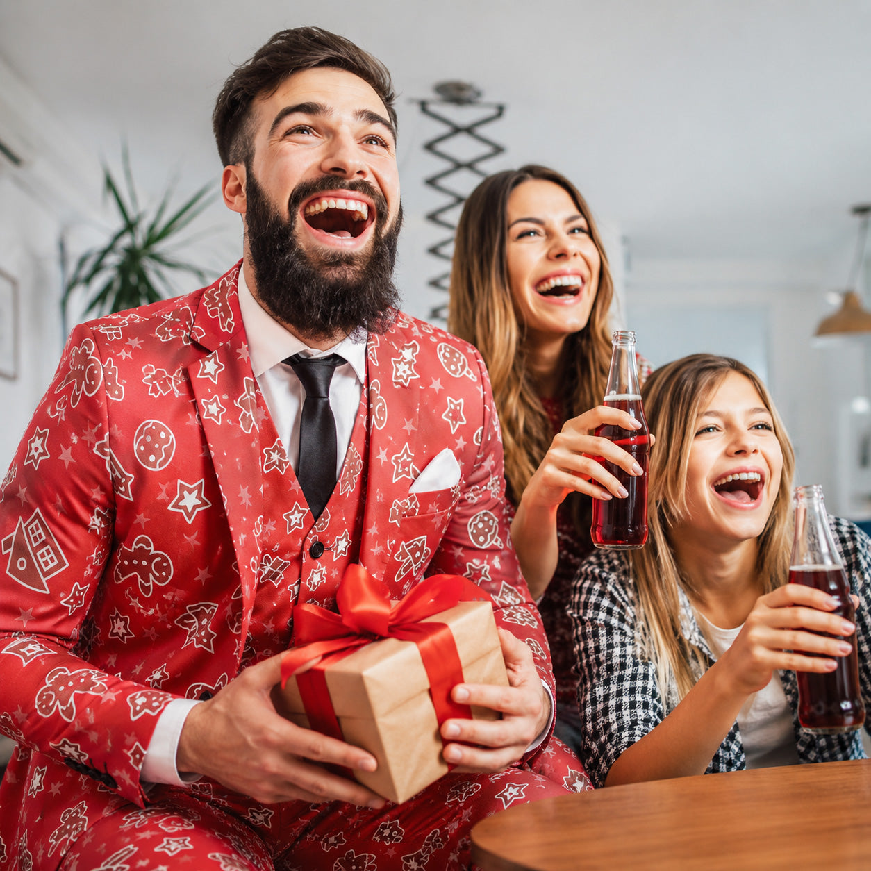 Happy man celebrating holiday season in a red gingerbread pattern suit jacket by WISHOLIC.
