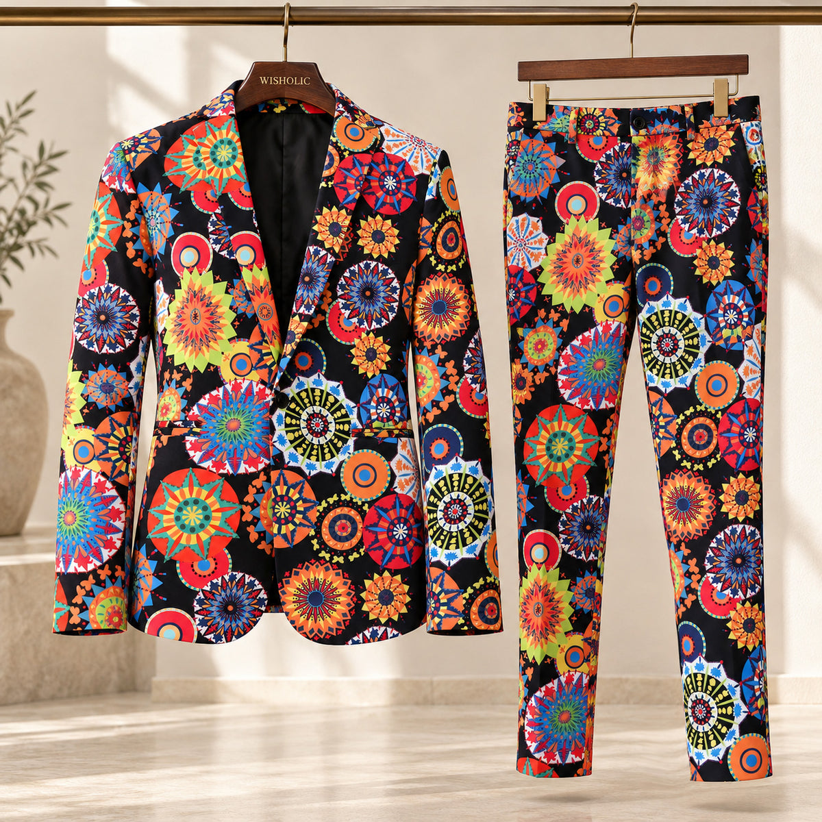 Wisholic men's vibrant mandala geometric pattern suit jacket and matching trousers displayed on wooden hangers in a boutique setting