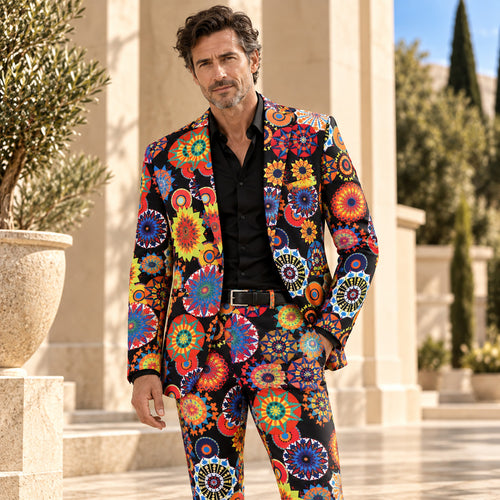 Handsome male model wearing a Wisholic colorful medallion mandala pattern suit jacket and matching trousers under Mediterranean sunlight