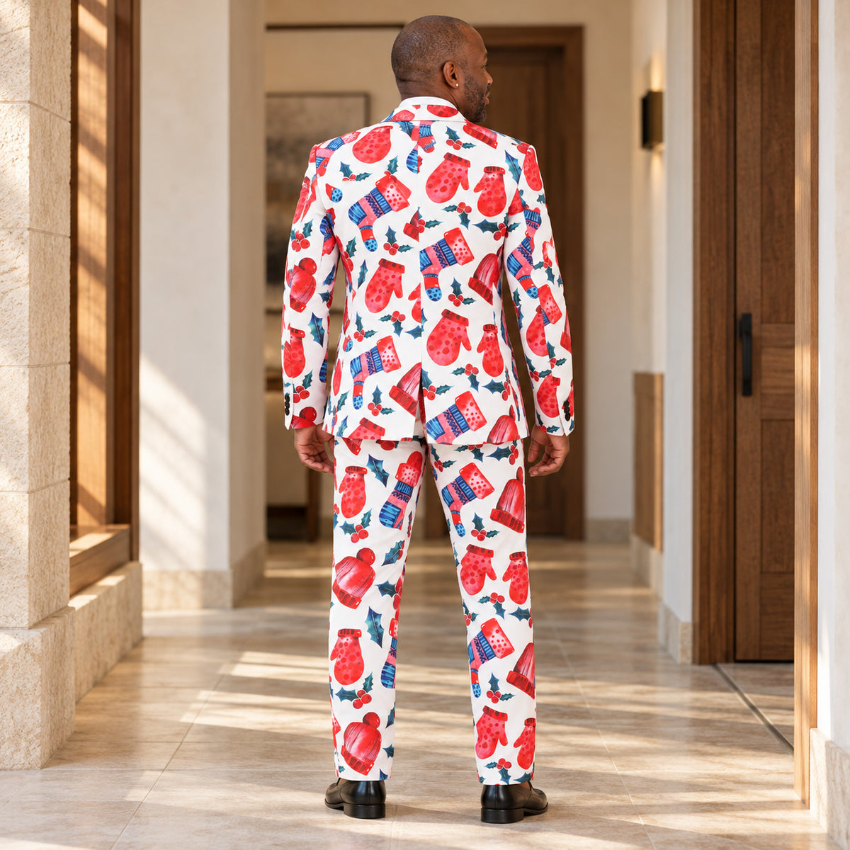 Back view of the WISHOLIC men's white Christmas print suit showing the festive red and blue holiday pattern, tailored blazer and matching trousers.