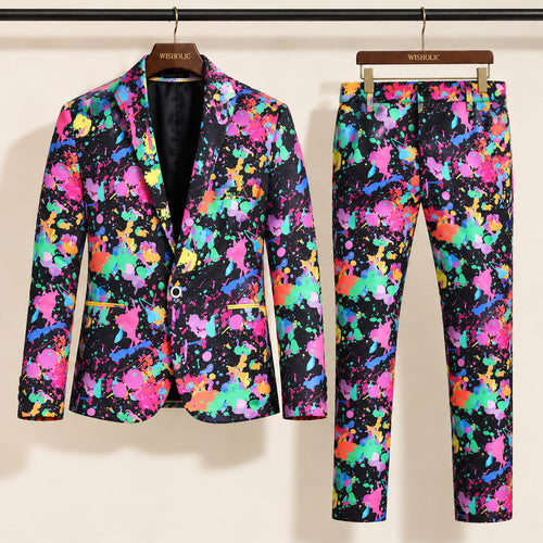 Wisholic neon paint splash printed two-piece suit with blazer and trousers hanging on wooden hangers