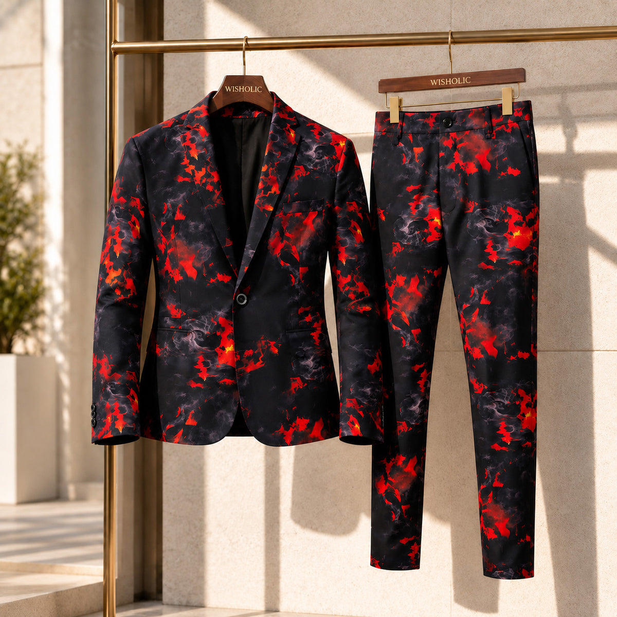 Wisholic men's 2-piece red flame printed suit jacket and matching trousers displayed on wooden hangers.